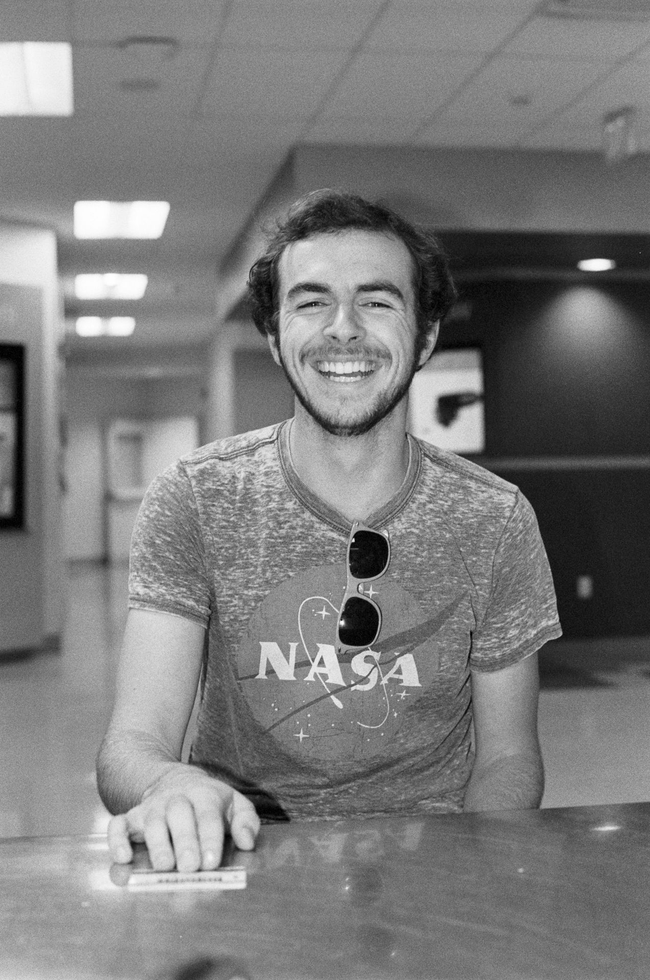 man in crew neck t-shirt smiling